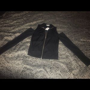 Off shoulder, long sleeve shirt w/ front zipper.